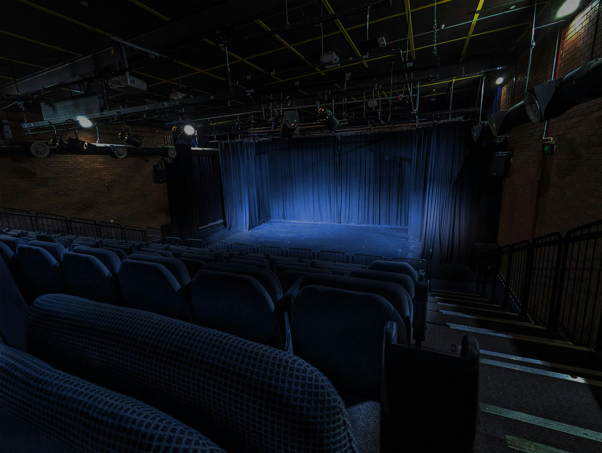 The Belconnen Community Theatre bathed in blue lighting