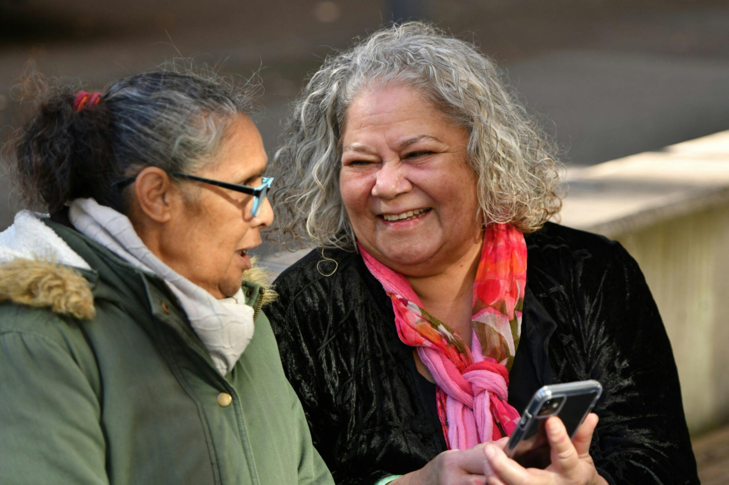 Two older Aboriginal women talking.