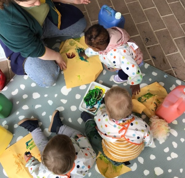 Picture of babies painting at Bruce Early Childhood Centre