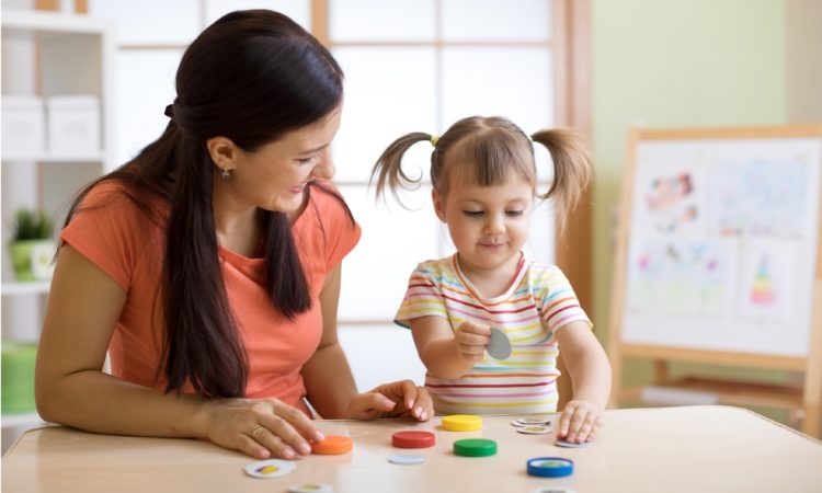 An Educator helping a child with autism